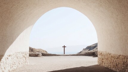 Cross overlooking serene seascape viewed through arched entryway.