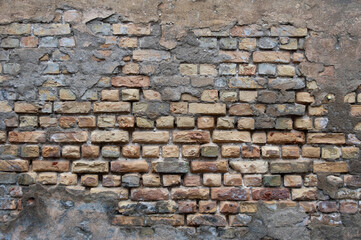brick wall, in the photo the texture of the old brick wall and plaster