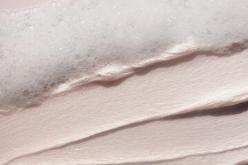 Cosmetic smudge swatch face  cleanser smudge brush stroke and soapy bubble foam on beige background