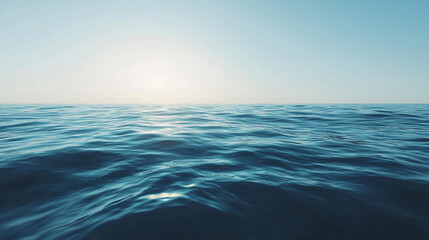 Serene ocean view at sunrise with gentle waves and clear blue sky, ideal for tranquil backgrounds