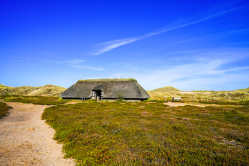 Landscape with a view of an Iron Age house on the North Frisian island of Amrum.
