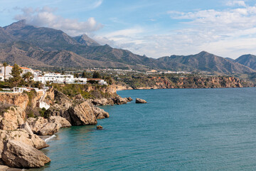 Fototapeta premium White buildings overlooking the mediterranean sea in nerja, spain