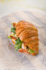 fresh croissant with filling on background