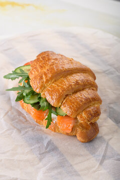 fresh croissant with filling on background