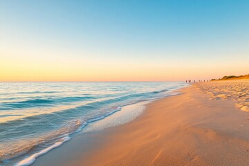 Obraz premium golden hour on serene beach with calm waves and soft sand underfoot