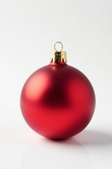 Small red Christmas ball against a bright white backdrop, , bold