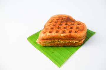 Tasty golden-brown waffle on a clean white background, perfect for breakfast or dessert