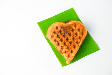 Tasty golden-brown waffle on a clean white background, perfect for breakfast or dessert