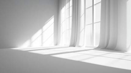 Obraz premium Sunlight streams through sheer curtains in a minimalist white room, ideal for interior design
