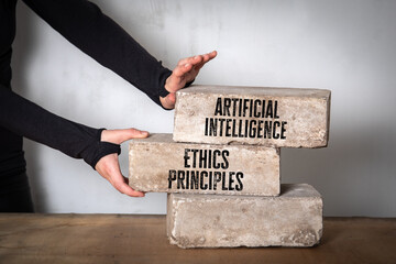 Artificial Intelligence Ethics Principles Concept. Stack of white bricks on a wooden table