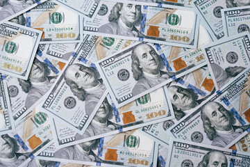 Pile of US One Hundred Dollar Bills Representing Wealth and Financial Success