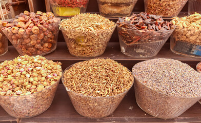Large choice of colorful spices in the traditional arabian market in Dubai