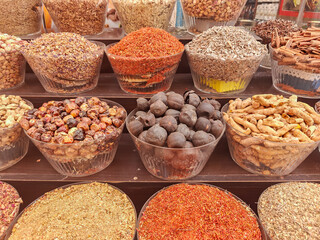 Large choice of colorful spices in the traditional arabian market in Dubai