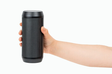 Portable wireless speaker in hand isolated on white background. Black mobile wireless bluetooth...