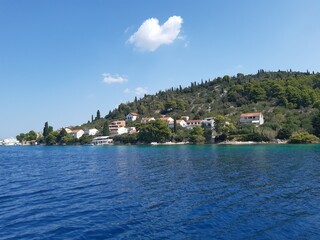 The beautiful view onto an old classical Croatian village from a small ship