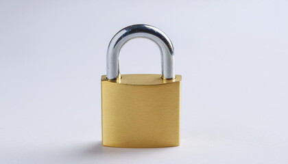 Fototapeta premium Golden padlock on light backdrop. Security, safety and protection concept.