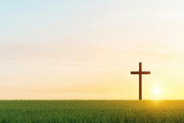 A solitary wooden cross stands in an open field at sunset, symbolizing faith and hope The warm colors create a serene atmosphere perfect for reflection