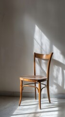 Fototapeta premium Solitary Wooden Chair Evoking Emptiness and Memory