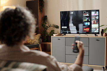 Watching Television and Holding Remote Control at Home