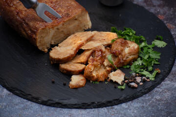 Seitan: vegan meat alternative made with vital wheat gluten, sliced on slate board