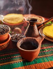 Steaming ethiopian coffee ceremony with incense, roasted beans, and traditional clay pot