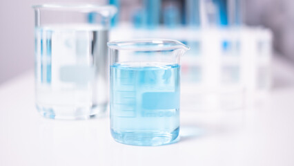 Laboratory beaker blue liquid chemistry chemical research science medical equipment