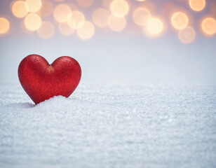 Fototapeta premium February 14 postcard, red heart on the snow among blurry lights, space for text,