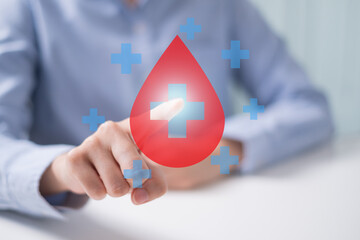 Professional health care worker doctor physician holding blood icon for blood donation concept