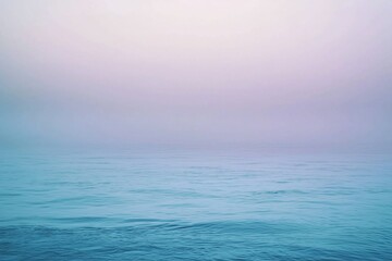 Serene ocean view at dawn with soft pastel colors blending into a tranquil horizon, evoking calm
