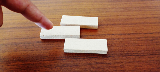 Text STRESS on wooden cubes on bright orange ocher background. Pressure or tension. Physiological, biological or psychological is an organism's response to stressor. Square wood blocks. Top view, flat