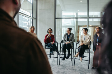 Businesswomen speaking at conference event, engaging in a professional discussion