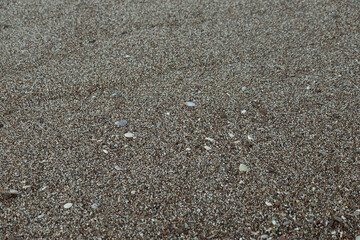 Background of small multicolored pebbles of the city beach of Budva, Montenegro. High quality photo