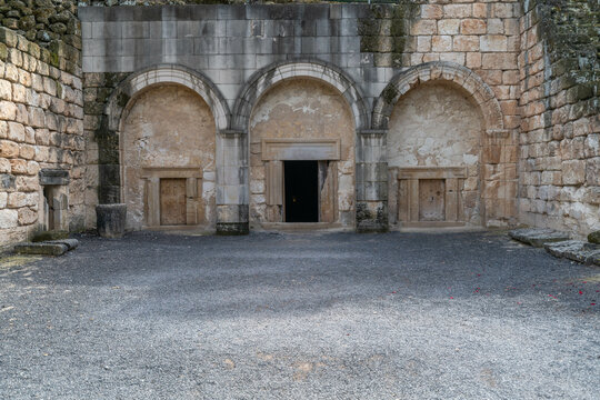 Entrance to Cave of the Coffins with it's beautiful arches and small carved rock doors at Beit She'arim in Kiryat Tivon, Israel catacombs with sarcophagi.
