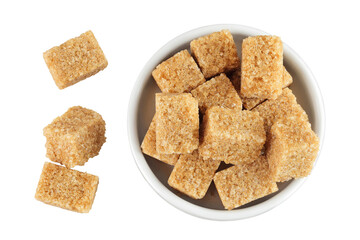 brown sugar in a ceramic bowl isolated on white background. Top view. Flat lay