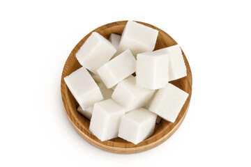 Sugar cubes in a wooden bowl isolated on white background. Top view. Flat lay