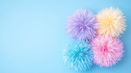 Obraz premium Pastel pom-poms on blue background, craft, decoration