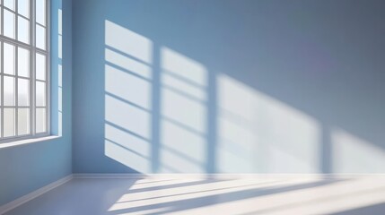 Obraz premium Bright and airy room with blue walls and sunlight casting shadows from a large window
