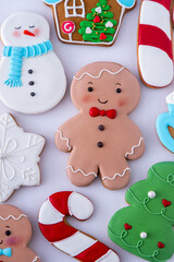 Gingerbread man decorated sugar glaze icing. Food background. Christmas cookies top view set