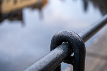 Railing Close-Up with River Reflection