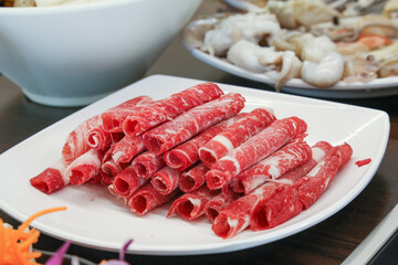 Shabu Shabu. Thinly sliced ​​beef on a plate
