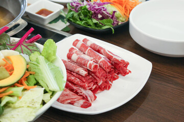 Shabu Shabu. Thinly sliced ​​beef on a plate