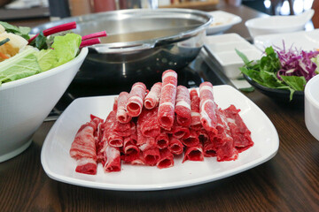 Shabu Shabu. Thinly sliced ​​beef on a plate