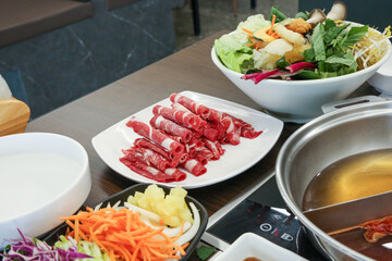 Shabu Shabu. Thinly sliced ​​beef on a plate