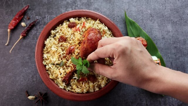 Chicken biryani Spicy Indian Malabar biryani Hyderabadi biryani, Dum Biriyani pulao golden bowl Kerala India Sri Lanka Pakistan basmati rice mixed rice dish with meat curry Ramadan Kareem, Eid
