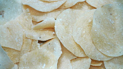 Close-Up of Thin Crisp Raw Potato Crackers in a Light, Golden-Brown Color