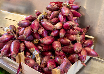 Pile of Fresh red onion on the market 
