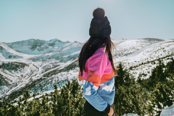 Beautiful Young Woman in the winter mountain 