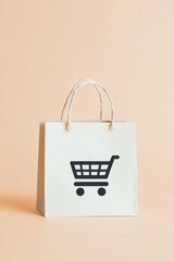 A small, elegant paper shopping bag featuring a shopping cart logo rests on a light pastel background.