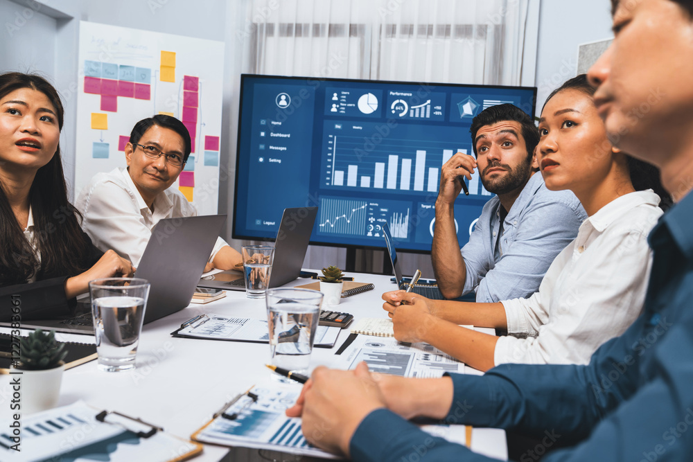 Poster analyst team utilizing bi fintech to analyze financial data at table in meeting room. businesspeople