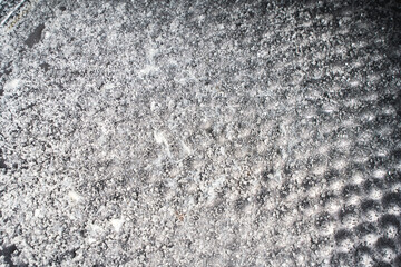 Background with the texture of a baking dish in sugar. Close-up.